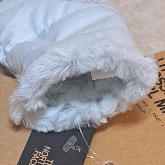The North Face Littles Mossbud Swirl reversible mittens in a light blue color - Picture 3 of 10